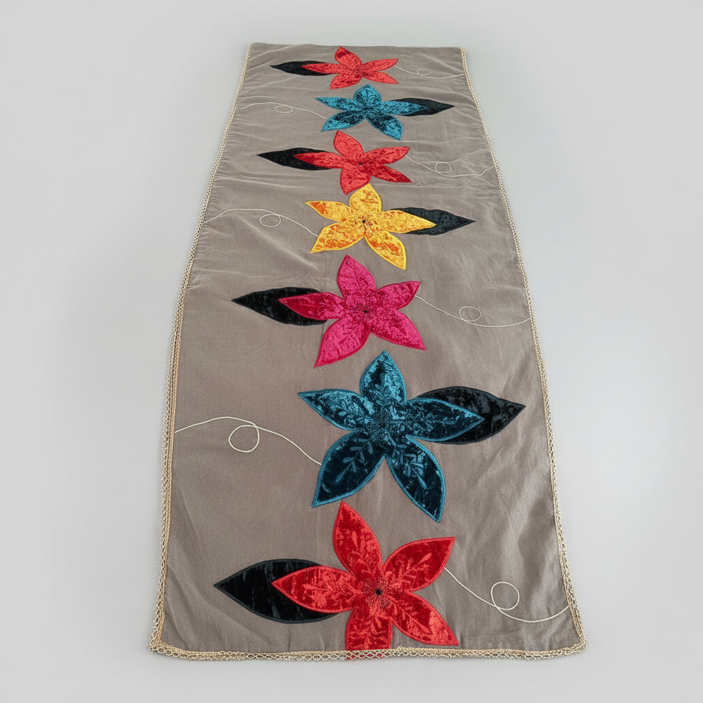 Floral appliqué design on a fabric surface with red, yellow, and blue flowers.