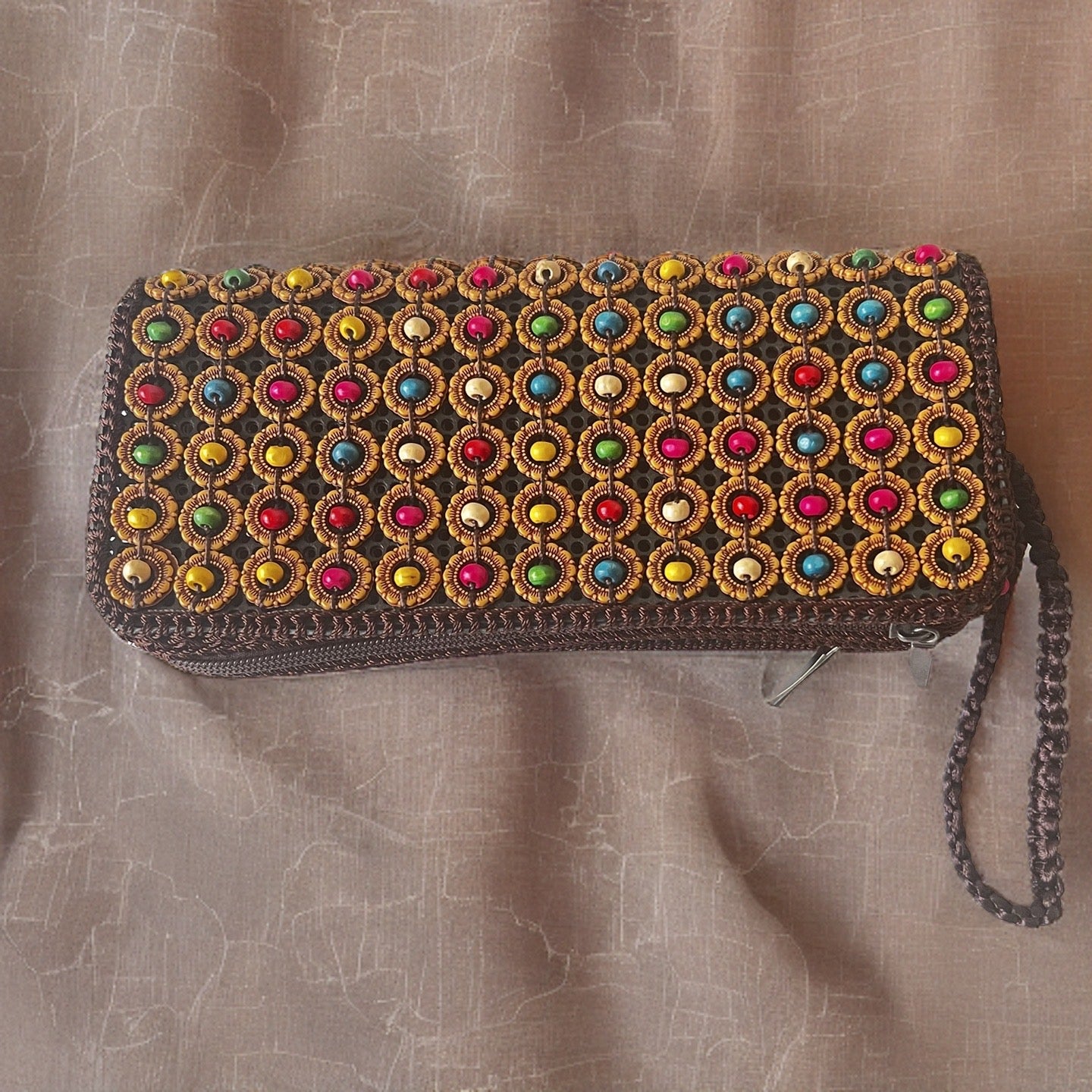 Handmade eco-friendly clutch bag crafted from natural coconut shells.